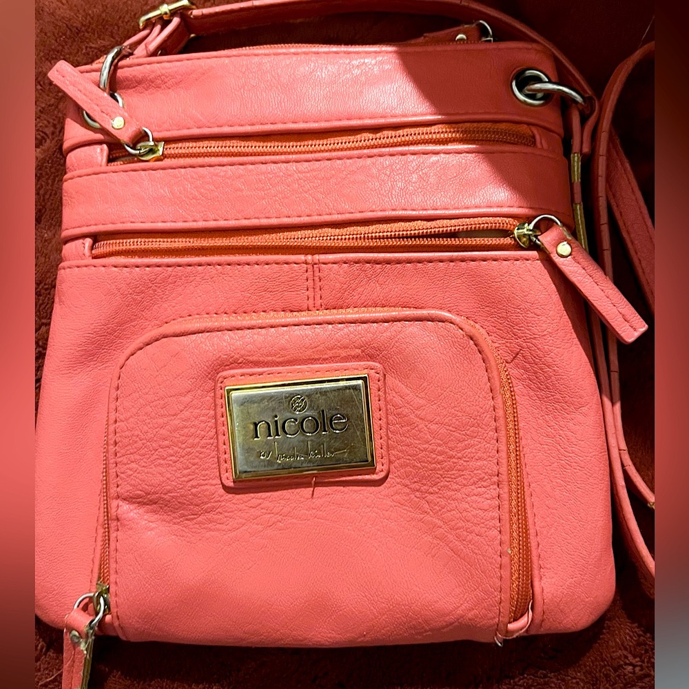 mini Nicole miller orange purse.